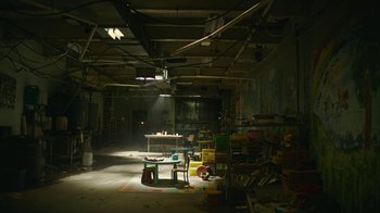 Movie still from “The Last of Us” (2023), created by Neil Druckmann – A room filled with lots of books and toys; Extreme Wide shot, High angle