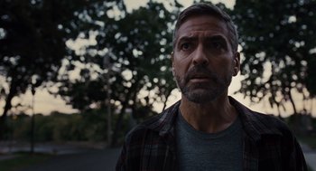 Movie still from “Burn After Reading” (2008), directed by Joel Coen – A person wearing a plaid shirt; Close Up shot, Low angle