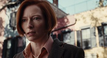 Movie still from “Burn After Reading” (2008), directed by Joel Coen – A person with short hair; Close Up shot, Over the shoulder angle