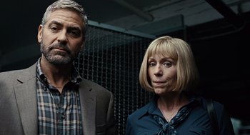 Movie still from “Burn After Reading” (2008), directed by Joel Coen – A man and a woman standing next to each other; Close Up shot, Low angle