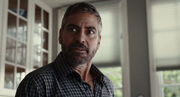 Movie still from “Burn After Reading” (2008), directed by Joel Coen – A person wearing a shirt; Close Up shot, Over the shoulder angle
