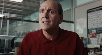 Movie still from “Burn After Reading” (2008), directed by Joel Coen – An older man with a surprised look on his face; Close Up shot, Low angle