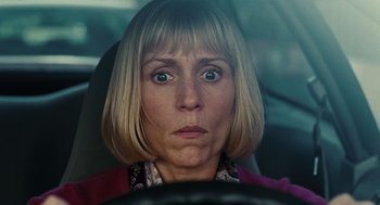 Movie still from “Burn After Reading” (2008), directed by Joel Coen – A person sitting in a car; Close Up shot, Low angle