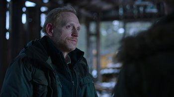 Movie still from “The Last of Us” (2023), created by Neil Druckmann – A person wearing a jacket; Close Up shot, Over the shoulder angle