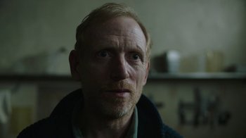 Movie still from “The Last of Us” (2023), created by Neil Druckmann – A person wearing a jacket; Close Up shot, Over the shoulder angle