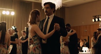 Movie still from “The Lobster” (2015), directed by Yorgos Lanthimos – A man and a woman are dancing in a ballroom; Medium shot, Over the shoulder angle