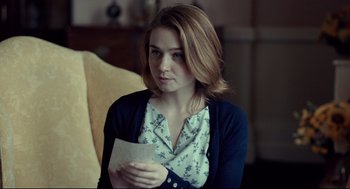 Movie still from “The Lobster” (2015), directed by Yorgos Lanthimos – A woman holding a piece of paper in her hands; Close Up shot, Over the shoulder angle