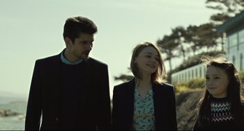 Movie still from “The Lobster” (2015), directed by Yorgos Lanthimos – A man and a woman standing next to each other; Medium shot, Low angle