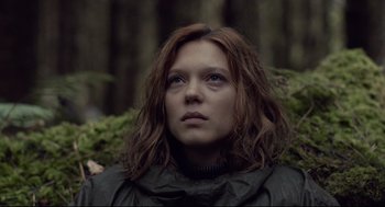 Movie still from “The Lobster” (2015), directed by Yorgos Lanthimos – A person with long brown hair; Close Up shot, Low angle