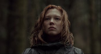 Movie still from “The Lobster” (2015), directed by Yorgos Lanthimos – A woman with long red hair is looking at the camera; Close Up shot, Low angle