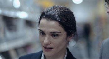 Movie still from “The Lobster” (2015), directed by Yorgos Lanthimos – A person wearing a suit; Close Up shot, Over the shoulder angle