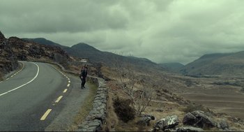 Movie still from “The Lobster” (2015), directed by Yorgos Lanthimos – Two people walking down the side of a road; Extreme Wide shot, High angle