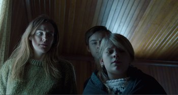 Movie still from “The Lodge” (2019), directed by Severin Fiala – Medium shot, Low angle