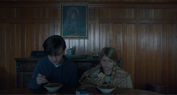 Movie still from “The Lodge” (2019), directed by Severin Fiala – Medium shot, Low angle