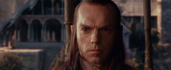 Movie still from “The Lord of the Rings: The Fellowship of the Ring” (2001), directed by Peter Jackson – A person with long brown hair; Close Up shot, Low angle