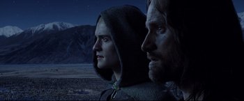 Movie still from “The Lord of the Rings: The Return of the King” (2003), directed by Peter Jackson – A man and a woman standing next to each other in the dark; Close Up shot, Low angle