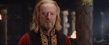 Movie still from “The Lord of the Rings: The Return of the King” (2003), directed by Peter Jackson – A man with a beard and long blond hair; Close Up shot, Over the shoulder angle