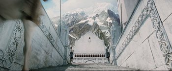 Movie still from “The Lord of the Rings: The Return of the King” (2003), directed by Peter Jackson – Two people are standing on the steps of a building; Extreme Wide shot, Low angle