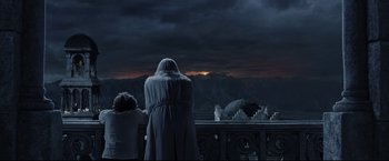 Movie still from “The Lord of the Rings: The Return of the King” (2003), directed by Peter Jackson – Two people looking out over the ocean at a sunset; Wide shot, Low angle