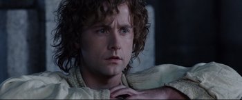Movie still from “The Lord of the Rings: The Return of the King” (2003), directed by Peter Jackson – A person with curly hair; Close Up shot, Low angle