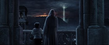 Movie still from “The Lord of the Rings: The Return of the King” (2003), directed by Peter Jackson – A woman and a child looking at a waterfall; Wide shot, Low angle