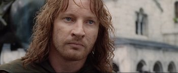 Movie still from “The Lord of the Rings: The Return of the King” (2003), directed by Peter Jackson – A person with long brown hair; Close Up shot, Over the shoulder angle