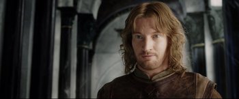 Movie still from “The Lord of the Rings: The Return of the King” (2003), directed by Peter Jackson – A person with long brown hair; Close Up shot, Over the shoulder angle