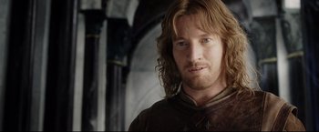 Movie still from “The Lord of the Rings: The Return of the King” (2003), directed by Peter Jackson – A person with long brown hair; Close Up shot, Over the shoulder angle