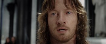 Movie still from “The Lord of the Rings: The Return of the King” (2003), directed by Peter Jackson – A person with long brown hair; Close Up shot, Over the shoulder angle