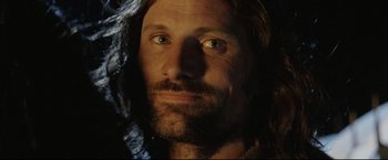 Movie still from “The Lord of the Rings: The Return of the King” (2003), directed by Peter Jackson – A person with long hair and a beard; Close Up shot, Low angle