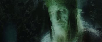 Movie still from “The Lord of the Rings: The Return of the King” (2003), directed by Peter Jackson – A man with long hair wearing a crown and a beard; Close Up shot, Low angle