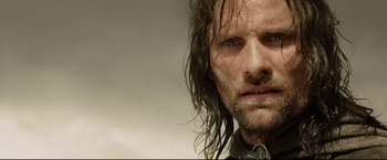 Movie still from “The Lord of the Rings: The Return of the King” (2003), directed by Peter Jackson – A person with wet hair; Close Up shot, Low angle