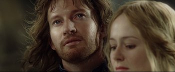 Movie still from “The Lord of the Rings: The Return of the King” (2003), directed by Peter Jackson – A person with long hair and blue eyes; Close Up shot, Over the shoulder angle