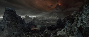 Movie still from “The Lord of the Rings: The Return of the King” (2003), directed by Peter Jackson – An image of an image of a volcano in the middle of the night; Extreme Wide shot, High angle