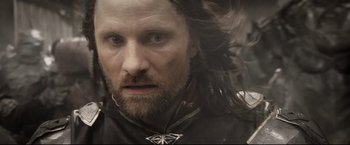 Movie still from “The Lord of the Rings: The Return of the King” (2003), directed by Peter Jackson – A person with long black hair; Close Up shot, Low angle