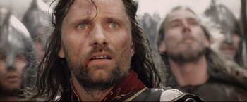 Movie still from “The Lord of the Rings: The Return of the King” (2003), directed by Peter Jackson – A person with blood on his face; Close Up shot, Low angle