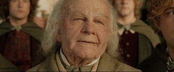 Movie still from “The Lord of the Rings: The Return of the King” (2003), directed by Peter Jackson – An old man with white hair is looking at the camera; Close Up shot, High angle