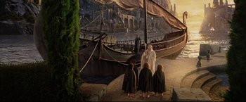Movie still from “The Lord of the Rings: The Return of the King” (2003), directed by Peter Jackson – A group of people standing next to each other on a dock; Extreme Wide shot, High angle