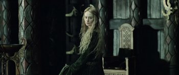 Movie still from “The Lord of the Rings: The Two Towers” (2002), directed by Peter Jackson – A woman with long blonde hair wearing a black dress; Medium shot, Over the shoulder angle