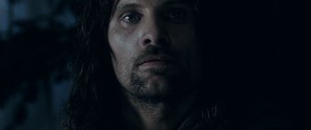 Movie still from “The Lord of the Rings: The Two Towers” (2002), directed by Peter Jackson – A person with long hair; Close Up shot, Low angle