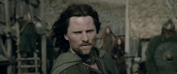 Movie still from “The Lord of the Rings: The Two Towers” (2002), directed by Peter Jackson – A person with long dark hair; Close Up shot, Low angle