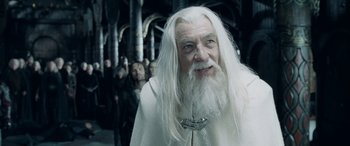 Movie still from “The Lord of the Rings: The Two Towers” (2002), directed by Peter Jackson – An old man with long white hair and a beard; Close Up shot, Over the shoulder angle
