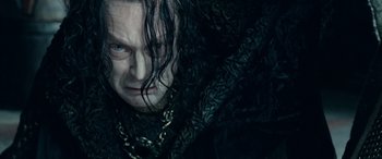 Movie still from “The Lord of the Rings: The Two Towers” (2002), directed by Peter Jackson – A person with long black hair; Close Up shot, Low angle
