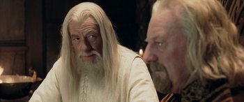 Movie still from “The Lord of the Rings: The Two Towers” (2002), directed by Peter Jackson – A man with long white hair sitting next to another man with a beard; Close Up shot, Over the shoulder angle