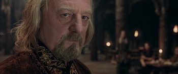 Movie still from “The Lord of the Rings: The Two Towers” (2002), directed by Peter Jackson – An older man with a beard and a mustache; Close Up shot, Over the shoulder angle