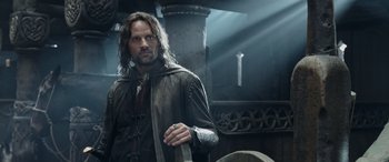 Movie still from “The Lord of the Rings: The Two Towers” (2002), directed by Peter Jackson – Aragorn in the lord of the rings movie; Medium shot, Low angle