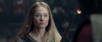 Movie still from “The Lord of the Rings: The Two Towers” (2002), directed by Peter Jackson – A person holding a sword in a room; Close Up shot, Over the shoulder angle