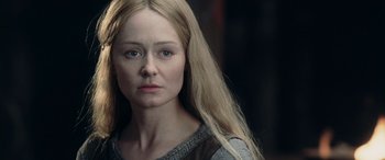 Movie still from “The Lord of the Rings: The Two Towers” (2002), directed by Peter Jackson – A person with long blonde hair; Close Up shot, Over the shoulder angle