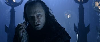 Movie still from “The Lord of the Rings: The Two Towers” (2002), directed by Peter Jackson – A person wearing a black robe; Close Up shot, Low angle