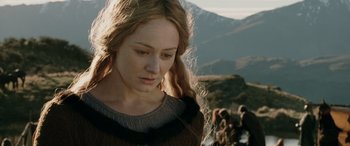 Movie still from “The Lord of the Rings: The Two Towers” (2002), directed by Peter Jackson – A woman with long blonde hair standing in front of a mountain; Close Up shot, Low angle